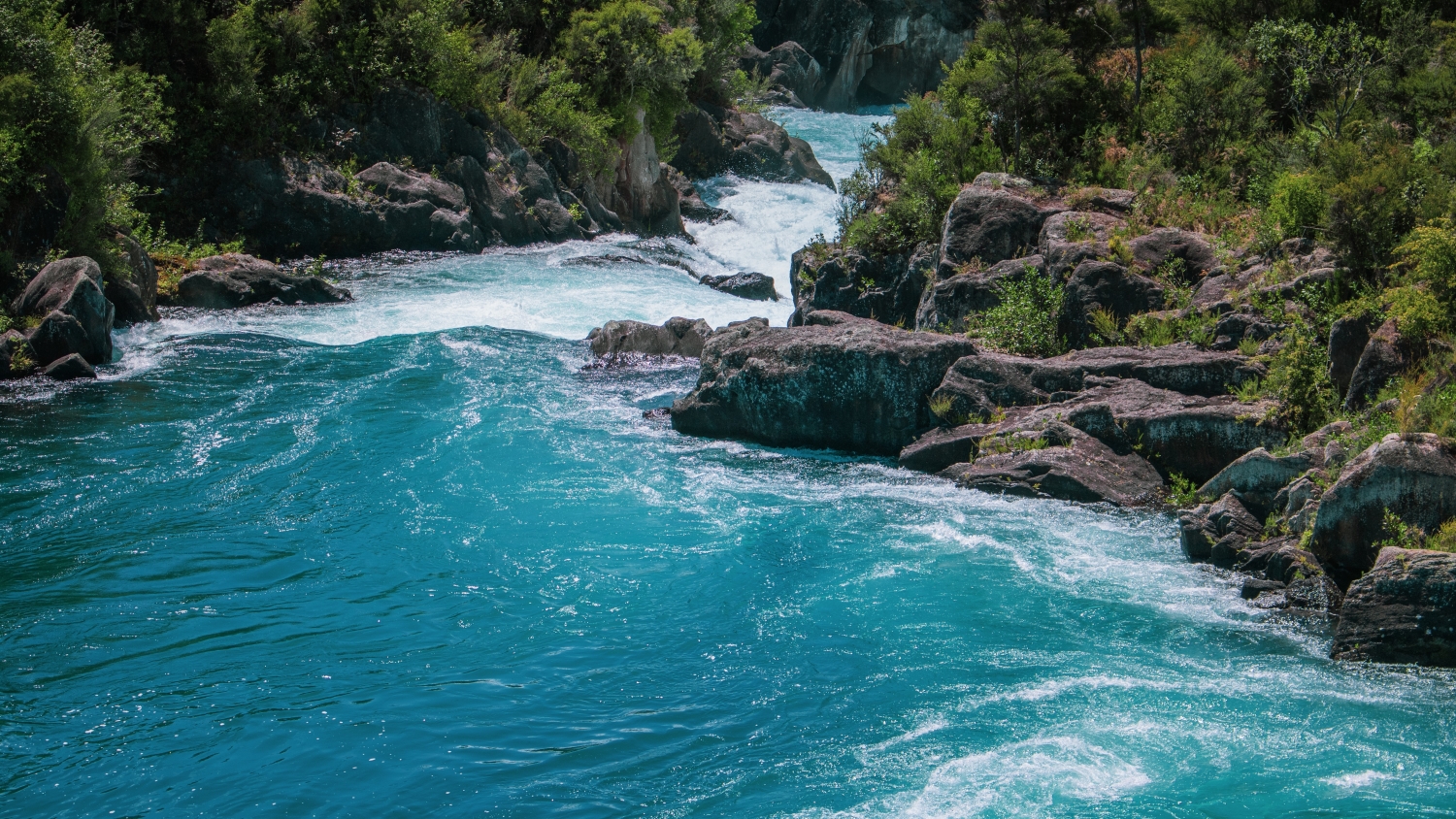 Eye level photo of the Huka falls taken from in the river