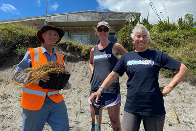 Alan and Angline Greensill with Coastcare Waikato coordinator Stacey Hill (centre) onsite after planting.